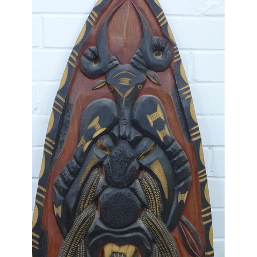 324 - Carved & painted African shield, 139cm