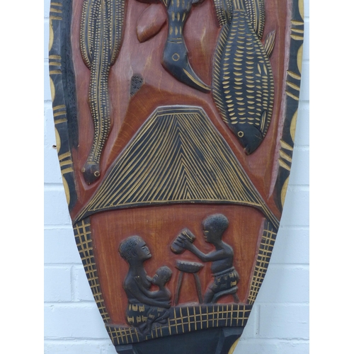 324 - Carved & painted African shield, 139cm