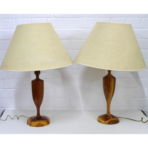 438 - A pair of wooden table lamp bases with shades, (2)