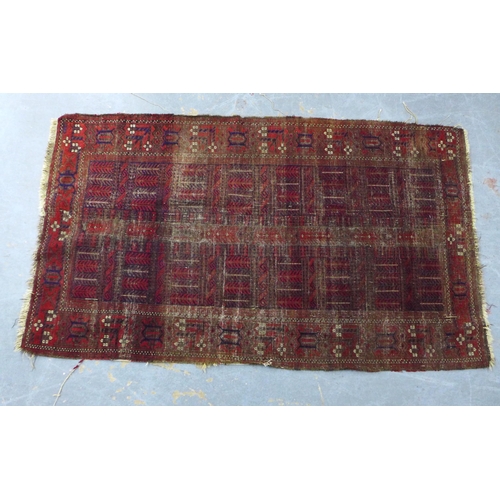 452 - Belouch rug with worn red field, 110 x 195cm.