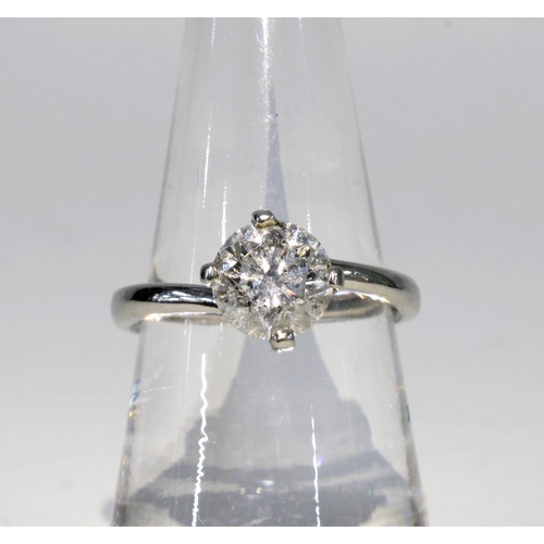 70A - Platinum and diamond solitaire ring, with a  one carat diamond in a four claw setting, band stamped ... 