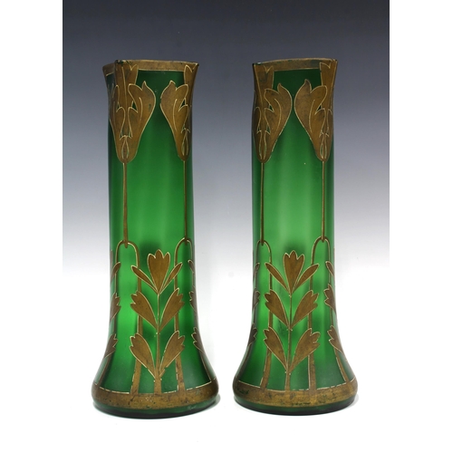 101 - A pair of French Art Nouveau green glass vases with stylised leaf pattern in gilt, of tall tapering ... 