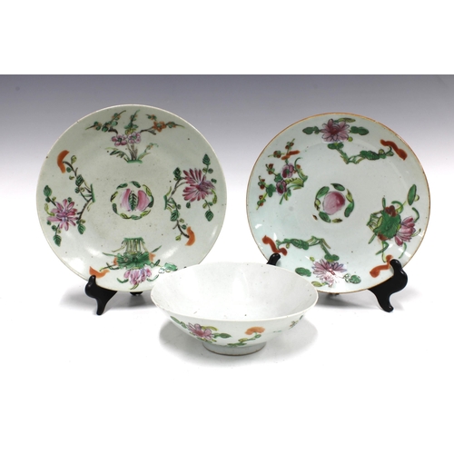 105 - Two Chinese fruit and flower pattern plates and a similarly decorated bowl,  (3) 23cm.