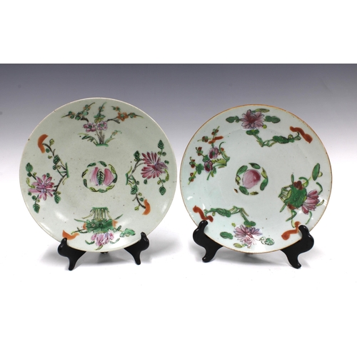 105 - Two Chinese fruit and flower pattern plates and a similarly decorated bowl,  (3) 23cm.