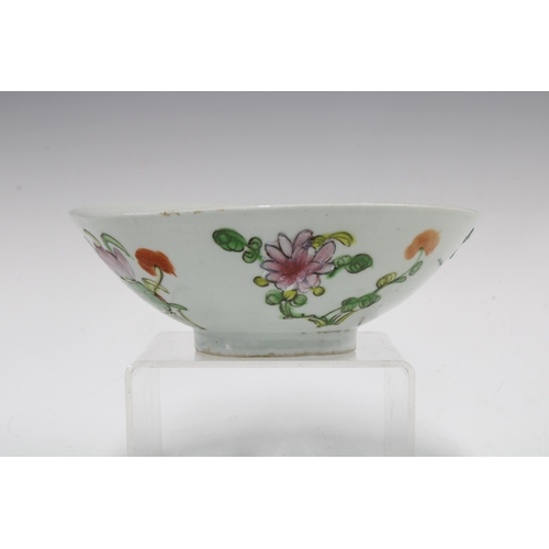 105 - Two Chinese fruit and flower pattern plates and a similarly decorated bowl,  (3) 23cm.