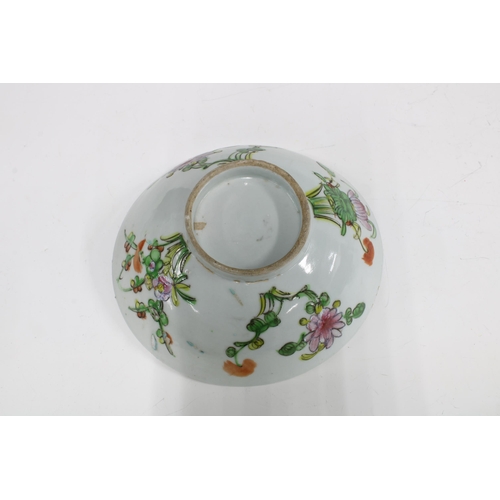 105 - Two Chinese fruit and flower pattern plates and a similarly decorated bowl,  (3) 23cm.