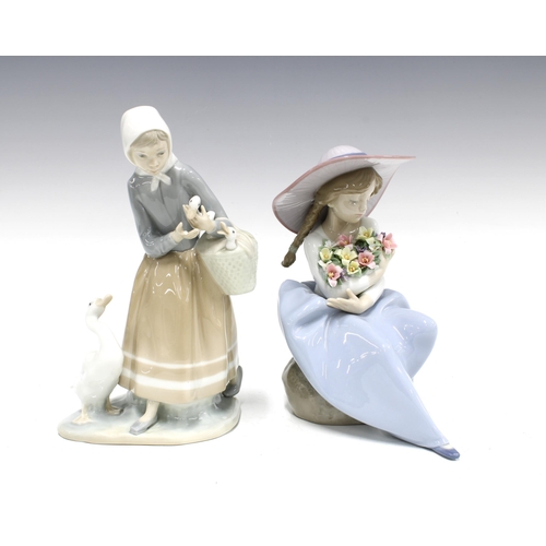 114 - Two Lladro figures to include Fragrant Bouquet Girl Model No 5862 and another (2) 14 x 23cm.