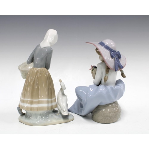 114 - Two Lladro figures to include Fragrant Bouquet Girl Model No 5862 and another (2) 14 x 23cm.