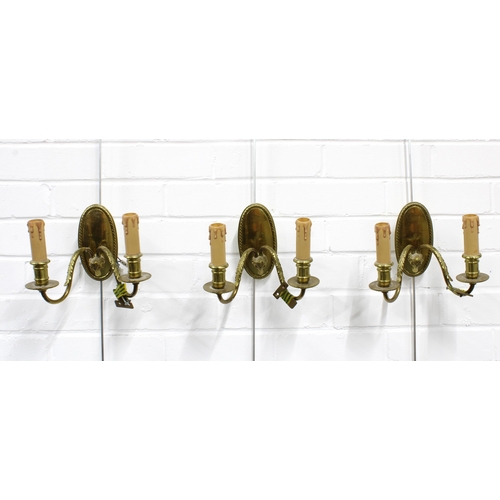 364 - A set of three brass wall lights with twin branches and shades (3) 22 x 16cm.