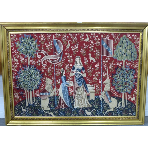 391 - Lady and the Unicorn, large wool tapestry, in a gilt frame, size 110 x 75cm