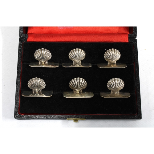 45 - A set of six silver shell menu card holders, stamped 925, in fitted box (6)