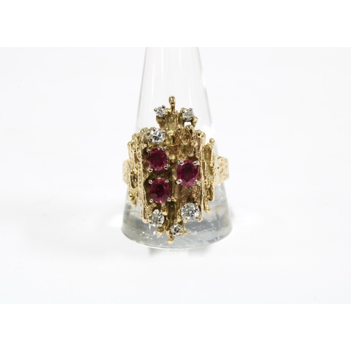 51 - Vintage 9ct gold ruby and diamond dress ring, London 1972, with three oval rubies and six diamonds, ... 