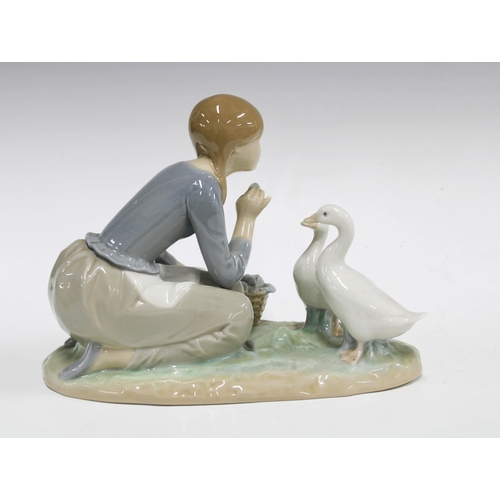 61 - Lladro figure of a girl feeding two geese, printed backstamp, 23 x 18cm.