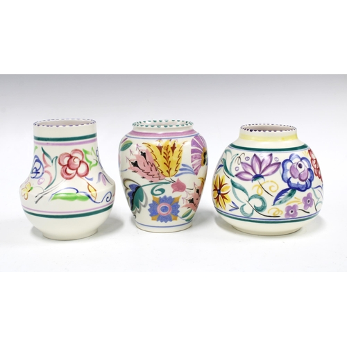 68 - Three Poole Pottery vases, floral decorated in coloured enamels (3) 13 x 12cm.