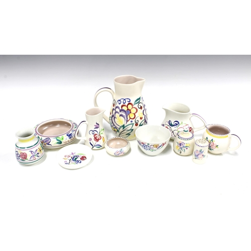 72 - A collection of Poole Pottery, floral decorated in coloured enamels, to include jugs, cruets and dis... 