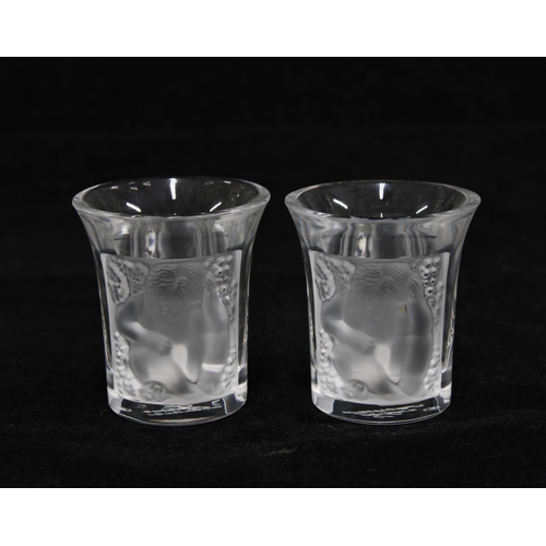 80 - A pair of Lalique  'Les Enfants' clear and frosted liqueur or shot glasses, signed and boxed (2) 4 x... 