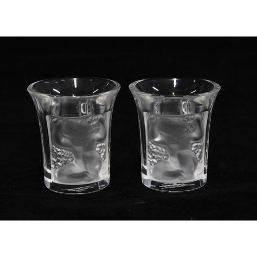 80 - A pair of Lalique  'Les Enfants' clear and frosted liqueur or shot glasses, signed and boxed (2) 4 x... 