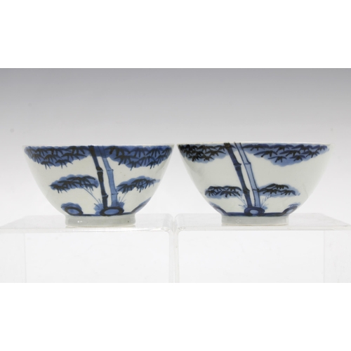 90 - Two Chinese blue and white bamboo & calligraphy pattern teabowls (2) 10 x 5cm.