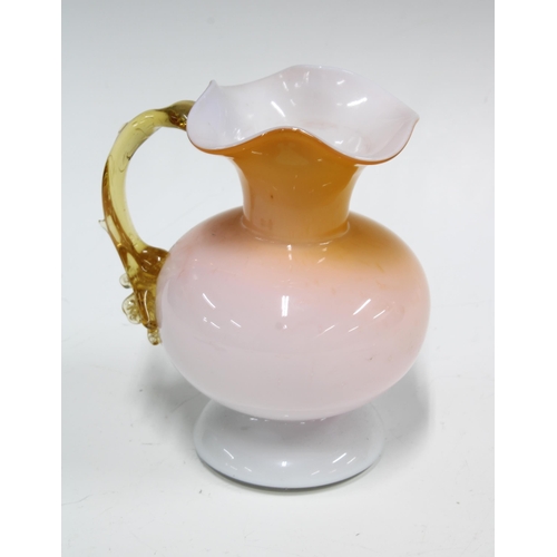 92 - Victorian cased glass jug in amber and white, 13 x 15cm.