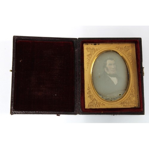 375 - Victorian Ambrotype of a Gent, in a fitted leather case with gilt metal mount, overall size 8 x 6cm