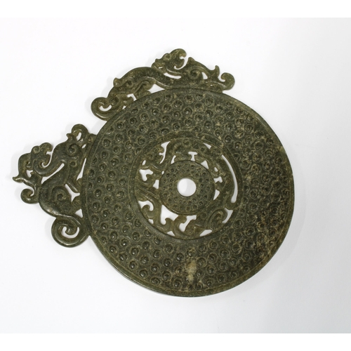 384 - Jade Bi Disc, textured and with pierced surmounts, 8.5cm diameter