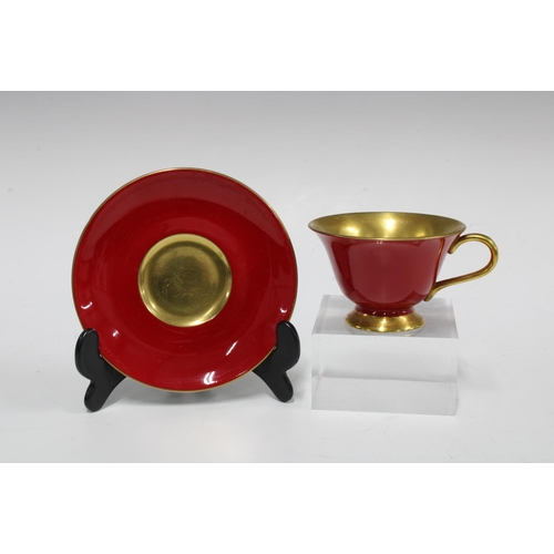 101 - The Royal Collection, a pair of red glazed porcelain cups and saucers (4)