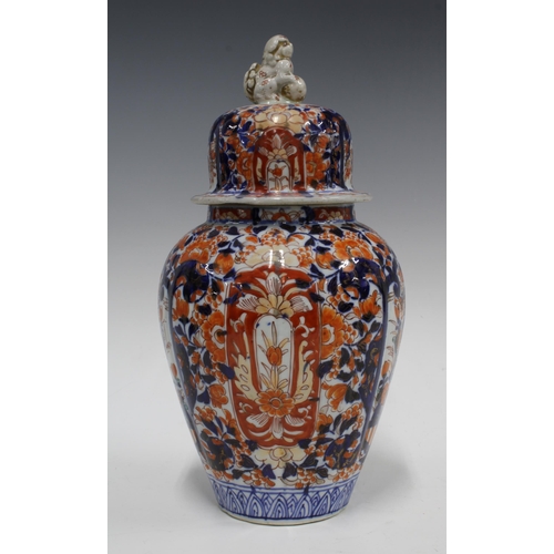 109 - A large Imari vase and cover of lobed form, the cover with a shishi finial, 34cm