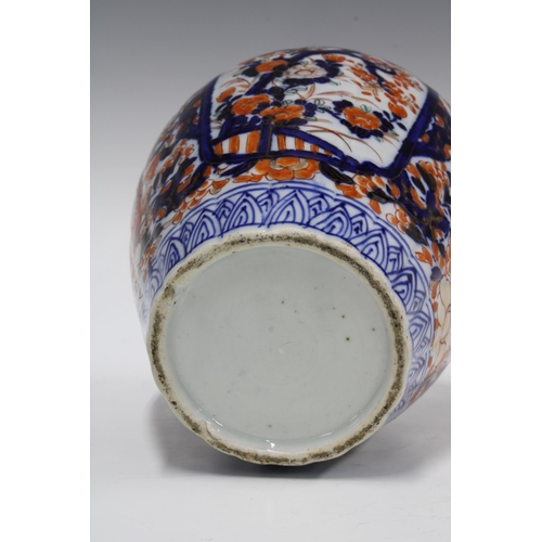 109 - A large Imari vase and cover of lobed form, the cover with a shishi finial, 34cm