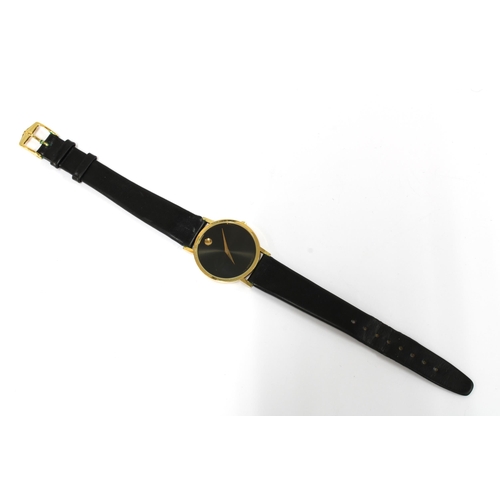 14 - MOVADO, a Gents manual wind wristwatch, black museum dial and gilt marker at 12, black leather strap