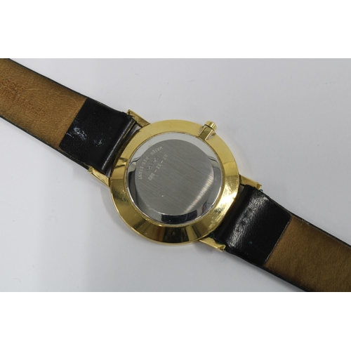 14 - MOVADO, a Gents manual wind wristwatch, black museum dial and gilt marker at 12, black leather strap