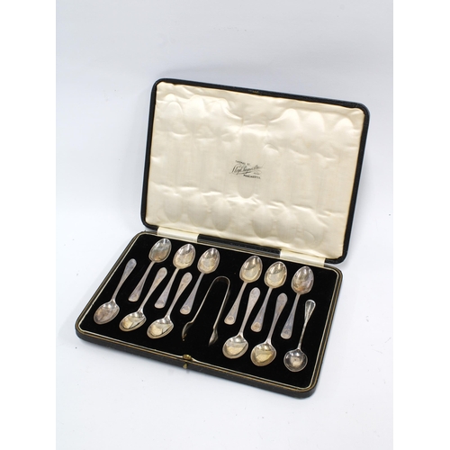 18 - George V cased set of twelve silver teaspoons with matching sugar tongs, Sheffield 1927