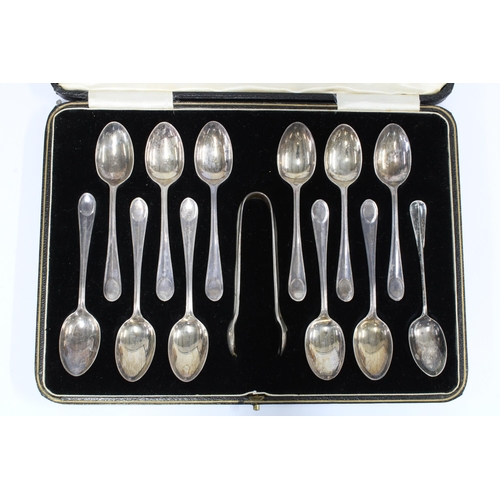 18 - George V cased set of twelve silver teaspoons with matching sugar tongs, Sheffield 1927