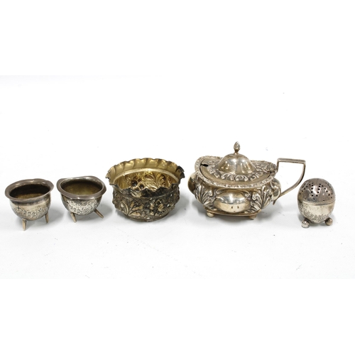 34 - A pair of miniature silver cauldron pots, silver condiments to include a pepper pot, salt and mustar... 