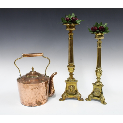 394 - Pair of brass candle holders, with faux cherries, taller 46cm, together with a copper kettle (3)