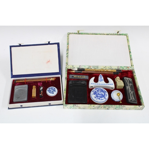 397 - Two chinoiserie boxed calligraphy sets, larger 29 x 19cm (2)