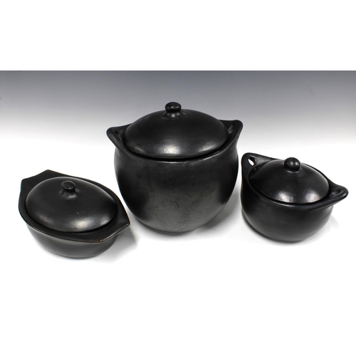 403 - Set of three black glazed pottery vessels with covers, largest 28 x 31cm (3)