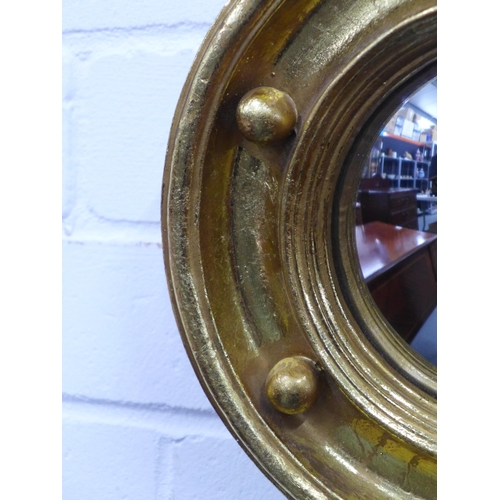 405 - Small wall mirror in a circular gilt ball frame,  24cm diameter