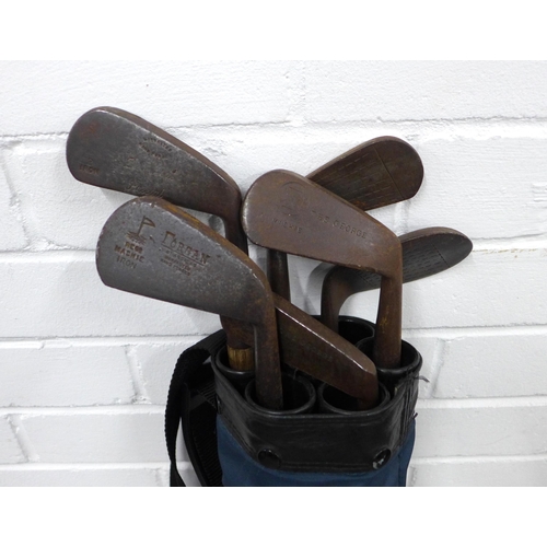 409 - Vintage hickory shaft golf clubs to include 'The George' Mashie and Forgan, etc with a golf bag, 88c... 