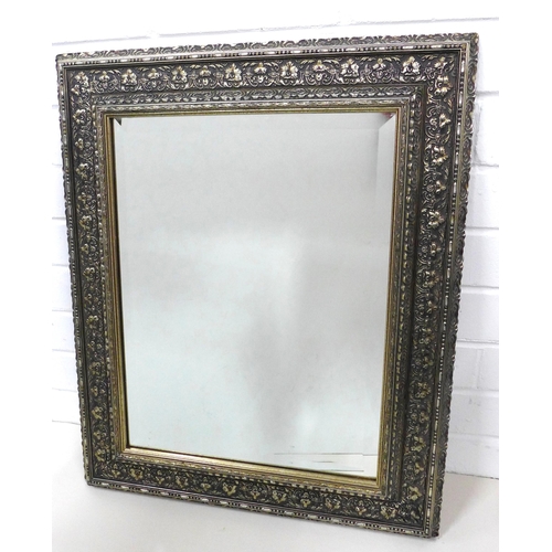 411 - Rectangular  wall mirror in a floral moulded silver gilt frame,  50 x 60cm