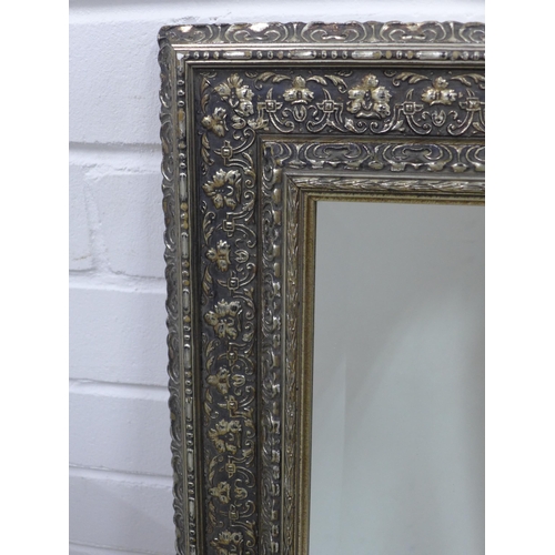 411 - Rectangular  wall mirror in a floral moulded silver gilt frame,  50 x 60cm