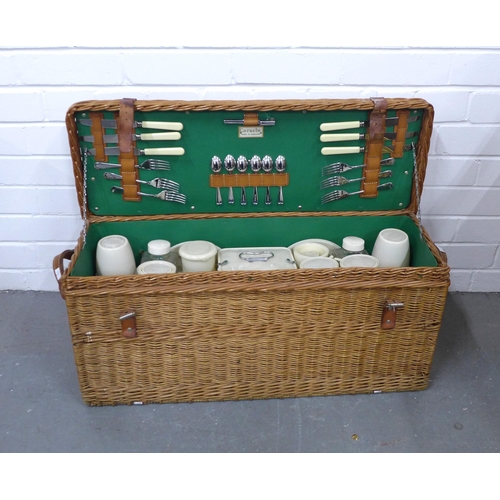 413 - Vintage Coracle wicker picnic basket with contents, 72 x 32 x 27cm