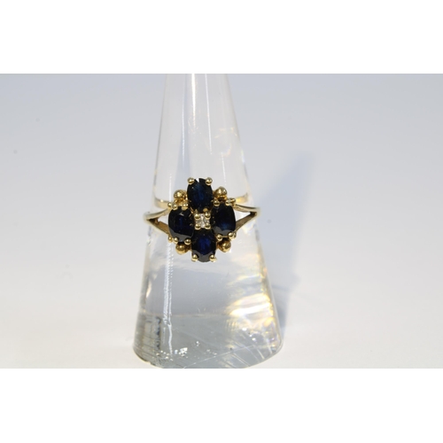 44 - 9ct gold sapphire and diamond cluster ring, size N, together with a silver fob medallion (2)