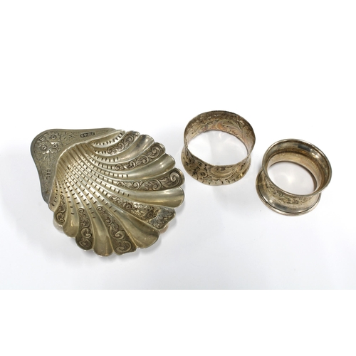 60 - Victorian silver shell dish, Birmingham 1891 and two silver napkin rings (3)