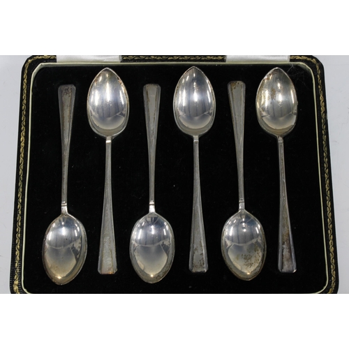 62 - Two cased sets of six silver teaspoons together with a cased set of six silver and shell teaspoons (... 