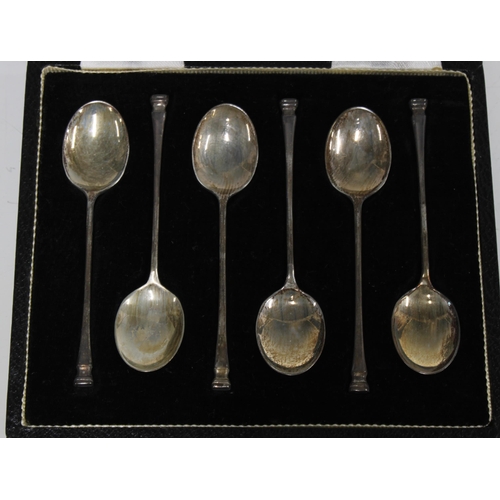 62 - Two cased sets of six silver teaspoons together with a cased set of six silver and shell teaspoons (... 