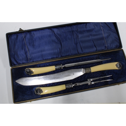 65B - Three piece carving set with composite handles and white metal mounts, in fitted case