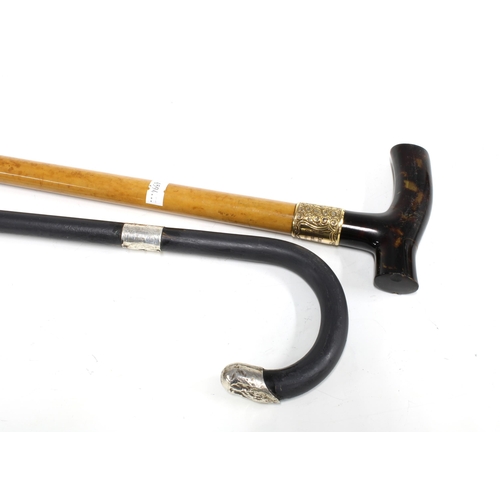 65D - A walking cane with yellow metal mount and faux tortoiseshell handle together with a silver mounted ... 