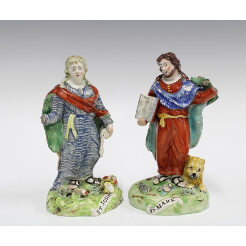 73 - Two early 19th century Walton pearlware pottery figures of St John and St Mark, both with losses, 18... 