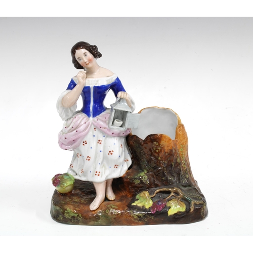 75 - 19th century porcelain figure with spill vase, on a naturalistic base, 17cm