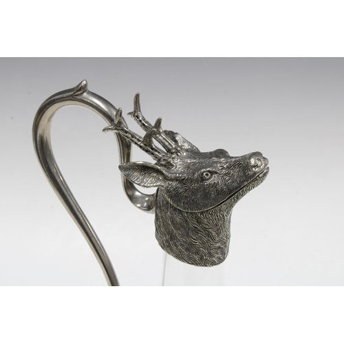 79 - Pewter and glass Stags head claret decanter, 30cm